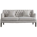 Block & Chisel linen upholstered button tufted sofa on oak wood legs