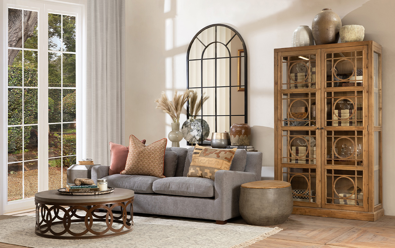 Eclectic living room with concrete coffee table, side table and wood display cabinet