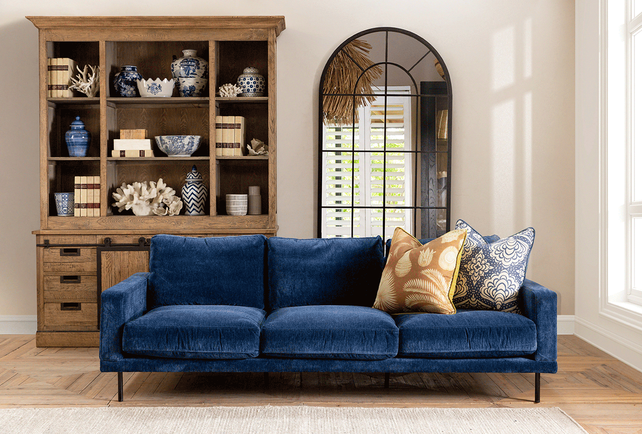 Minimalist Sofa in red, blue or grey velvet upholstery with Industrial-style cabinet and arched mirror
