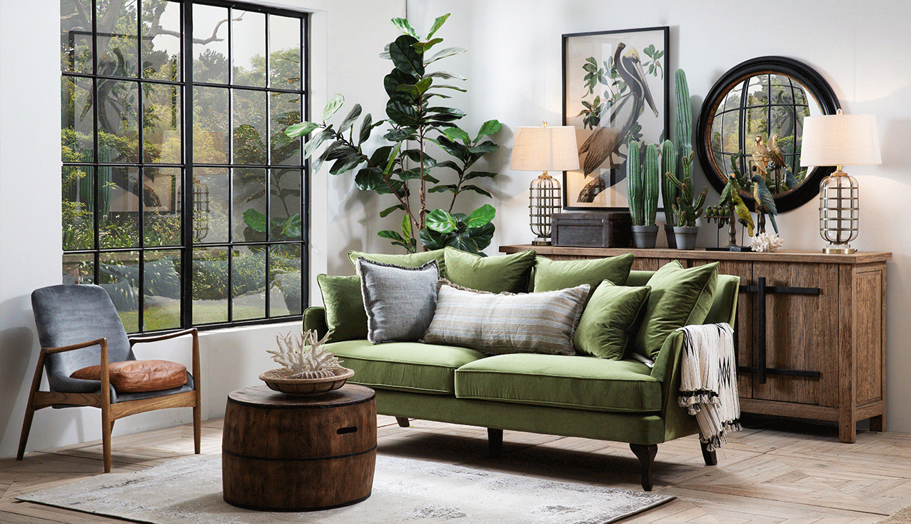 A classic living room scene with a velvet sofa in green and charcoal. 