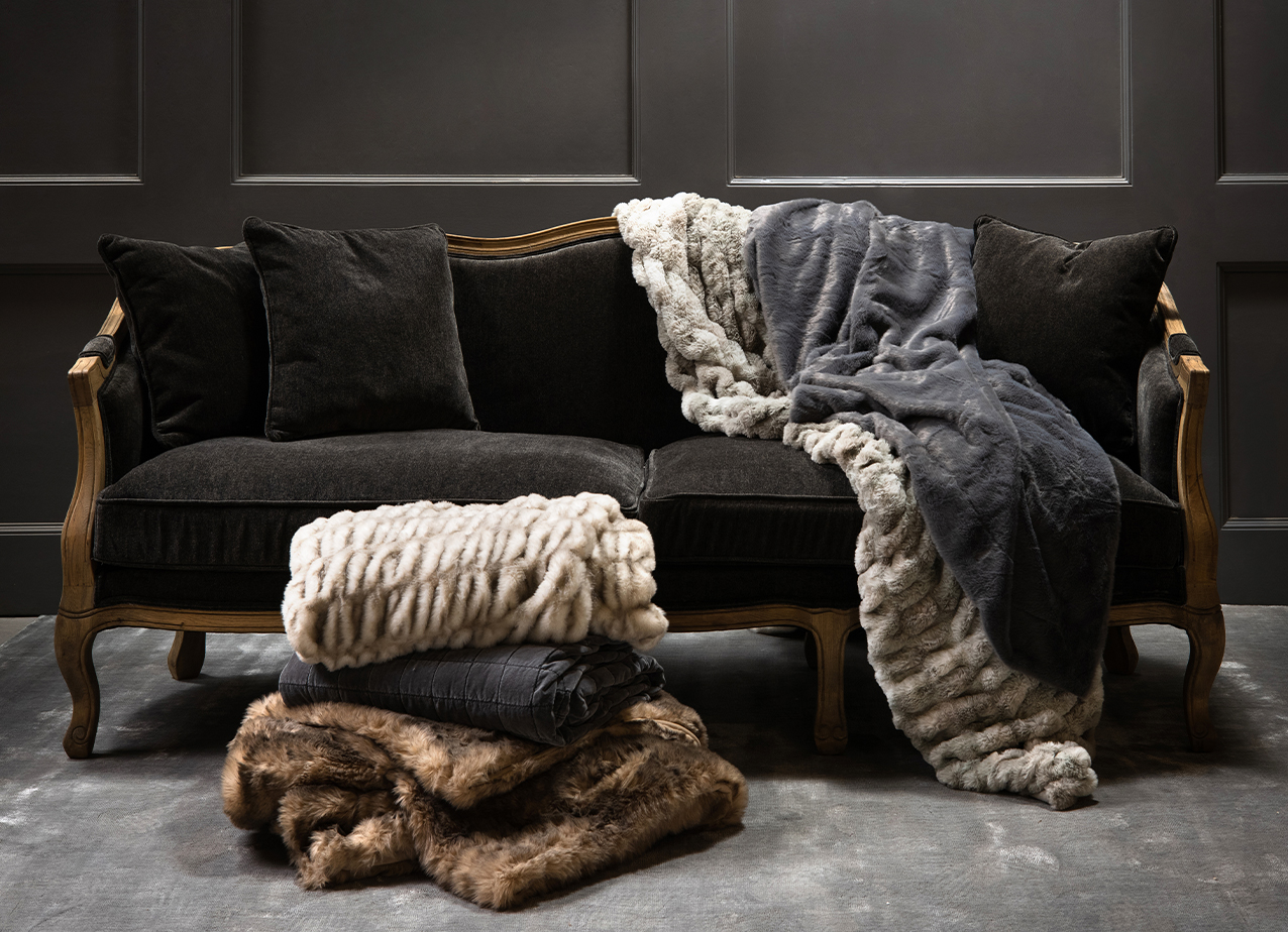 luxury faux fur throws on bergere sofa 