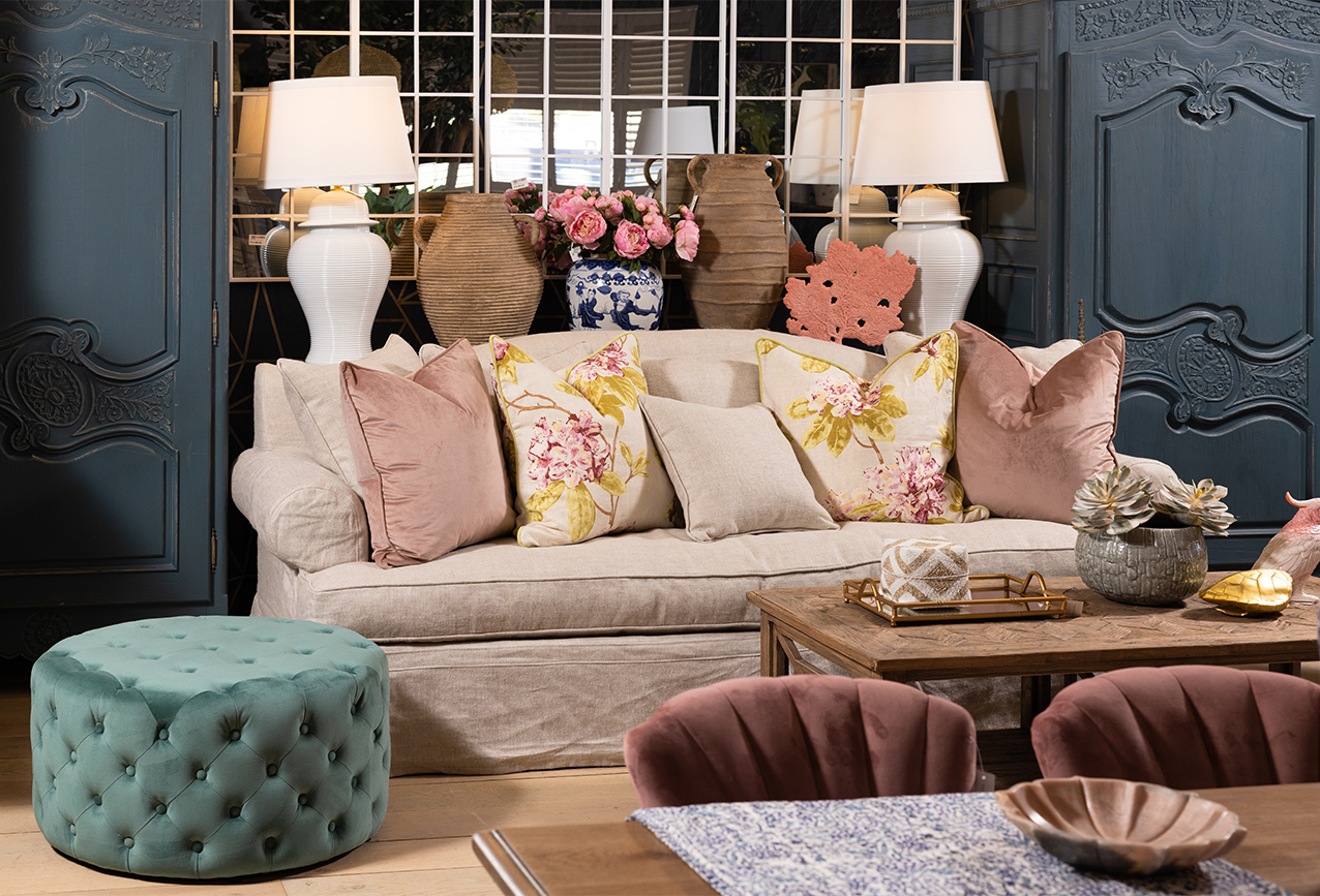 Soft Blush Pink Sofa with Buttoned Ottoman and Velvet Scatter Cushions 