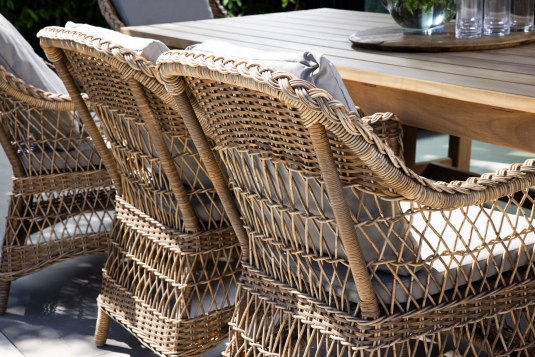 Outdoor armchair in synthetic rattan with cushions