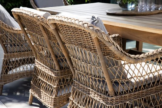 Outdoor armchair in synthetic rattan with cushions