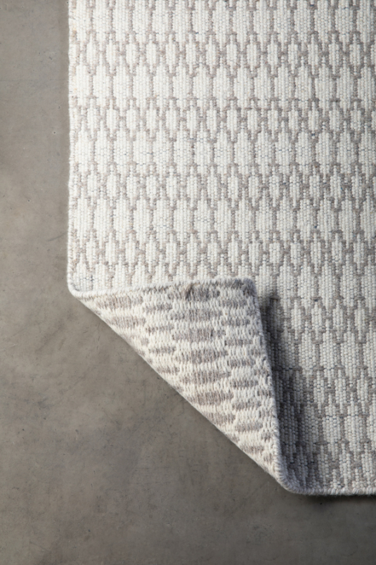 Block & Chisel cream wool rug with diamond detail