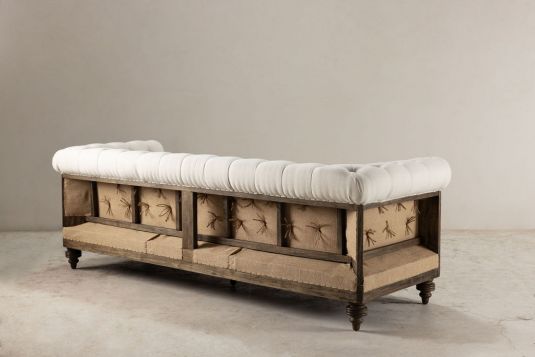 deconstructed chesterfield style sofa with wooden frame