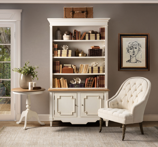 cream upholstered deco chair with deep buttoned detail, oak legs and castors, Château Collection 