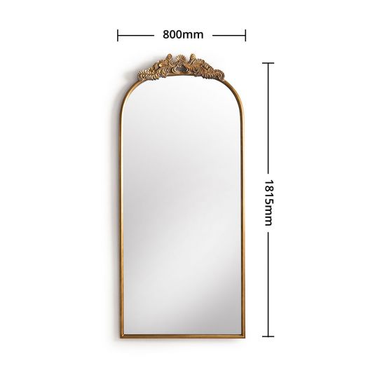Gold framed mirror with ornate top