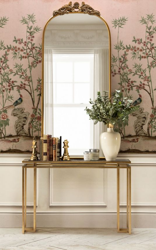 Gold framed mirror with ornate top