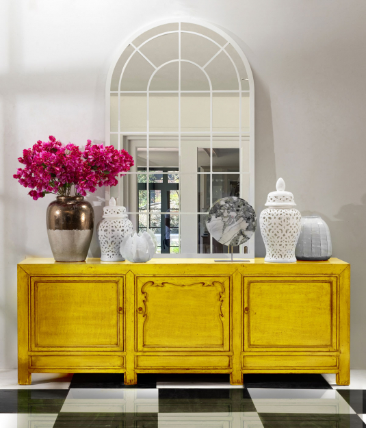 yellow lacquered sideboard with cupboards