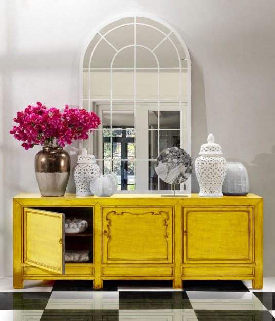 yellow lacquered sideboard with cupboards