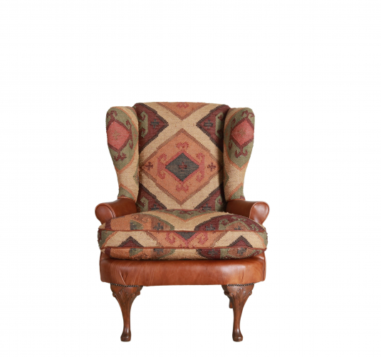 kilim and tan leather wingback chair