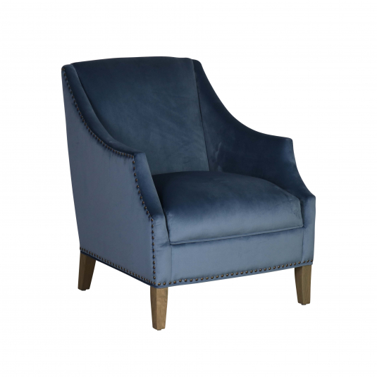 upholstered armchair in blue velvet with stud detail