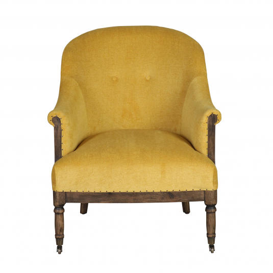 Deconstructed occasional chair with castors, upholstered in a mustard fabric.