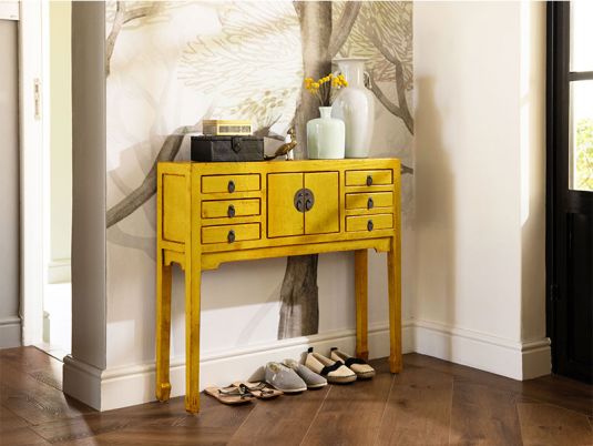 yellow lacquered asian inspired console