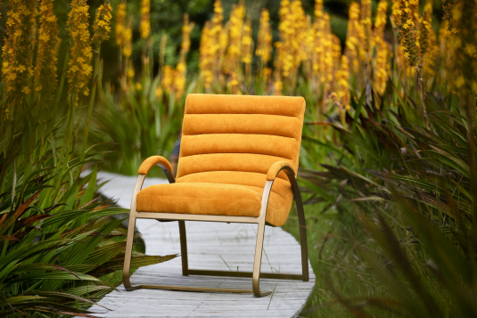 Gold metal framed chair upholstered in orange cord fabric. 