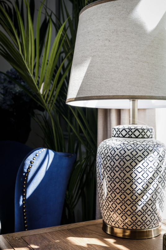 geometric pattern, oval lampbase with brass trim and white lampshade