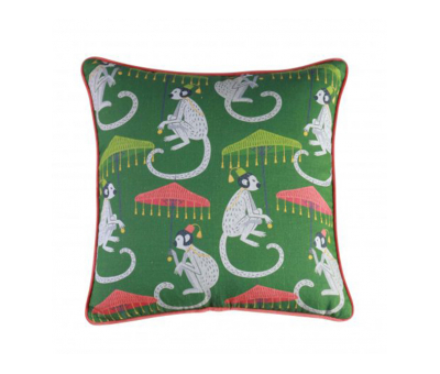 green cushion with monkey umbrella print 