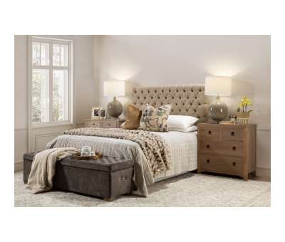 Block & Chisel brown upholstered bed end with oak wood feet