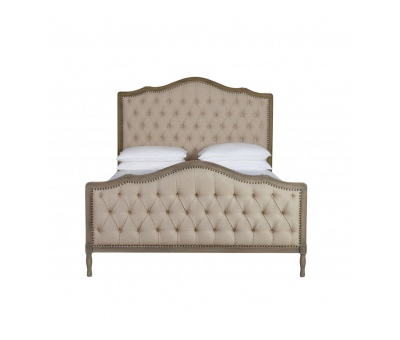 French style bed with deep button detail upholstered in linen