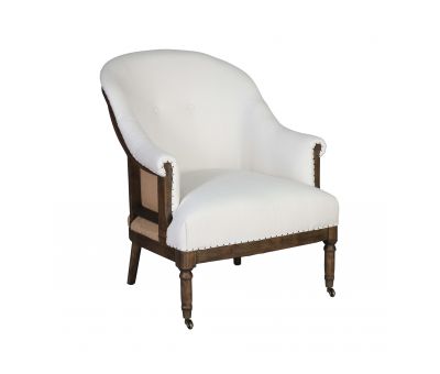 Deconstructed occasional chair with castors, upholstered in ivory fabric.