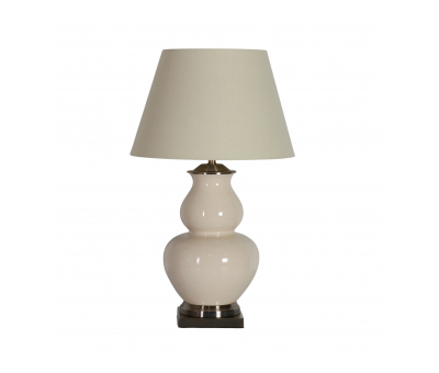 beige lamp with ceramic base and cone shape shade