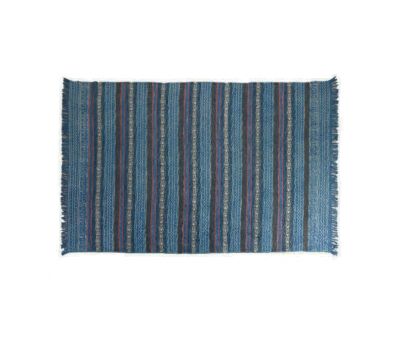 blue and red printed rug with fringe 