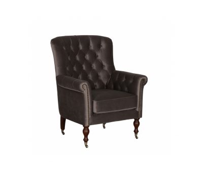 upholstered armchair with deep button detail and castors