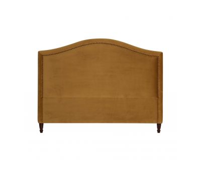 Upholstered gold headboard with stud detail