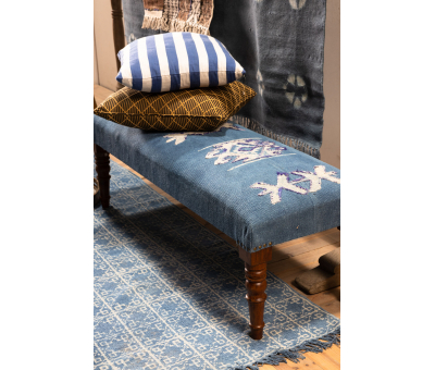 upholstered bench with turned wooden legs 