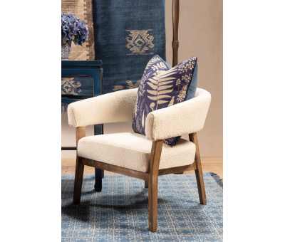 cream upholstered chair with light wooden frame