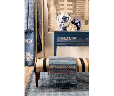 blue and red printed rug with fringe 