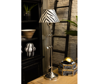 silver adjustable lamp and zebra shade
