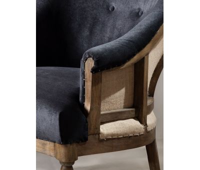 Deconstructed occasional chair with castors, upholstered in charcoal fabric