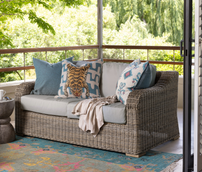 Constantia 2 seater in synthetic rattan and grey cushions