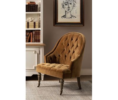 Deco chair upholstered in gold velour with deep buttoned detail, oak legs and castors Château Collection