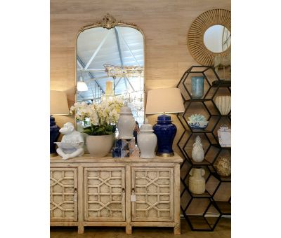 White chinese sideboard with detailed doors.