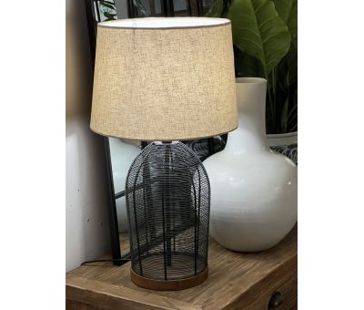 table lamp with black cage-like metal base and linen shade 