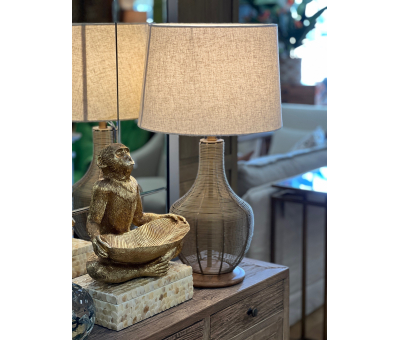 Table lamp with wired cage-like base brass with linen shade 