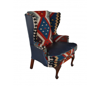 kilim and blue leather upholstered wingback chair 