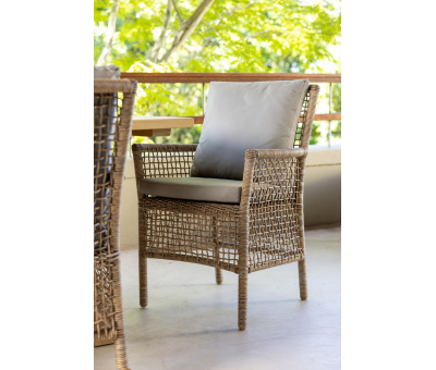Outdoor cane armchair with grey cushions 