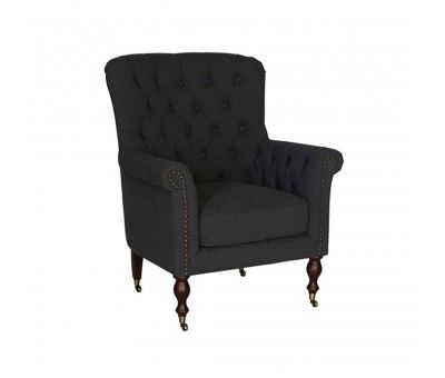 upholstered armchair with deep button detail and castors