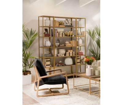 Gold metal bookshelf with wicker inlay shelving