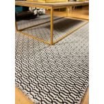 Block & Chisel stone coloured wool rug with black pattern detail