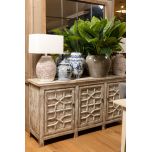 White chinese sideboard with detailed doors.