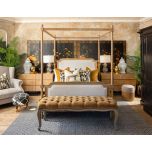 wooden 4 poster bed with fabric headboard and footboard