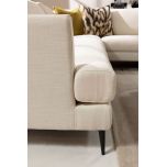 cream modern corner unit with freestanding ottoman