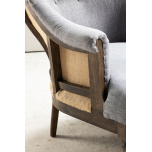 grey upholstered deconstructed chair on castors