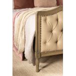 French style bed with deep button detail upholstered in linen
