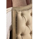 French style bed with deep button detail upholstered in linen